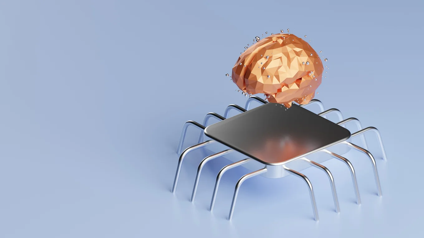 Metallic chip with legs and geometric brain shape.